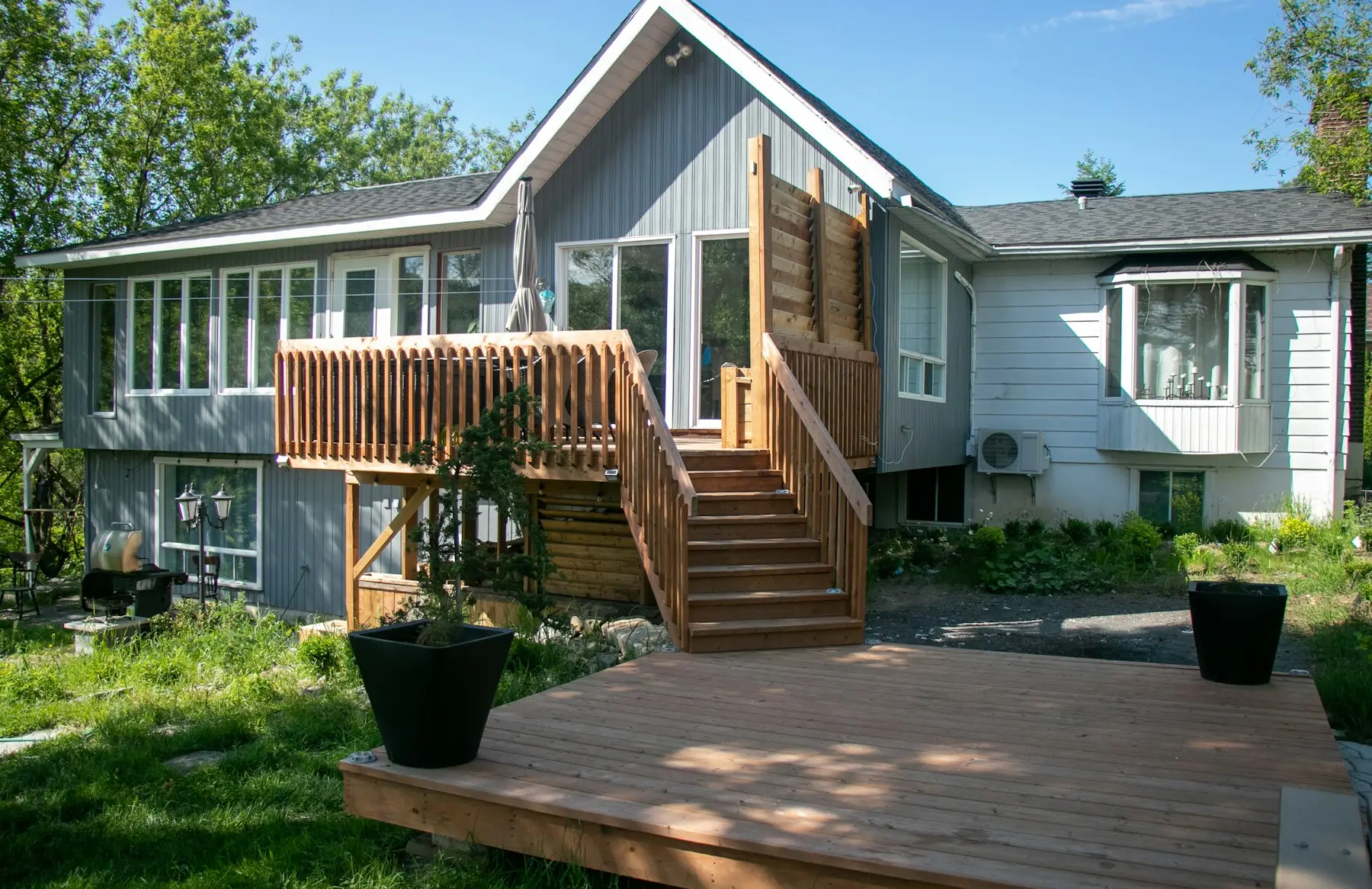 New wooden deck with stairs down to the yard