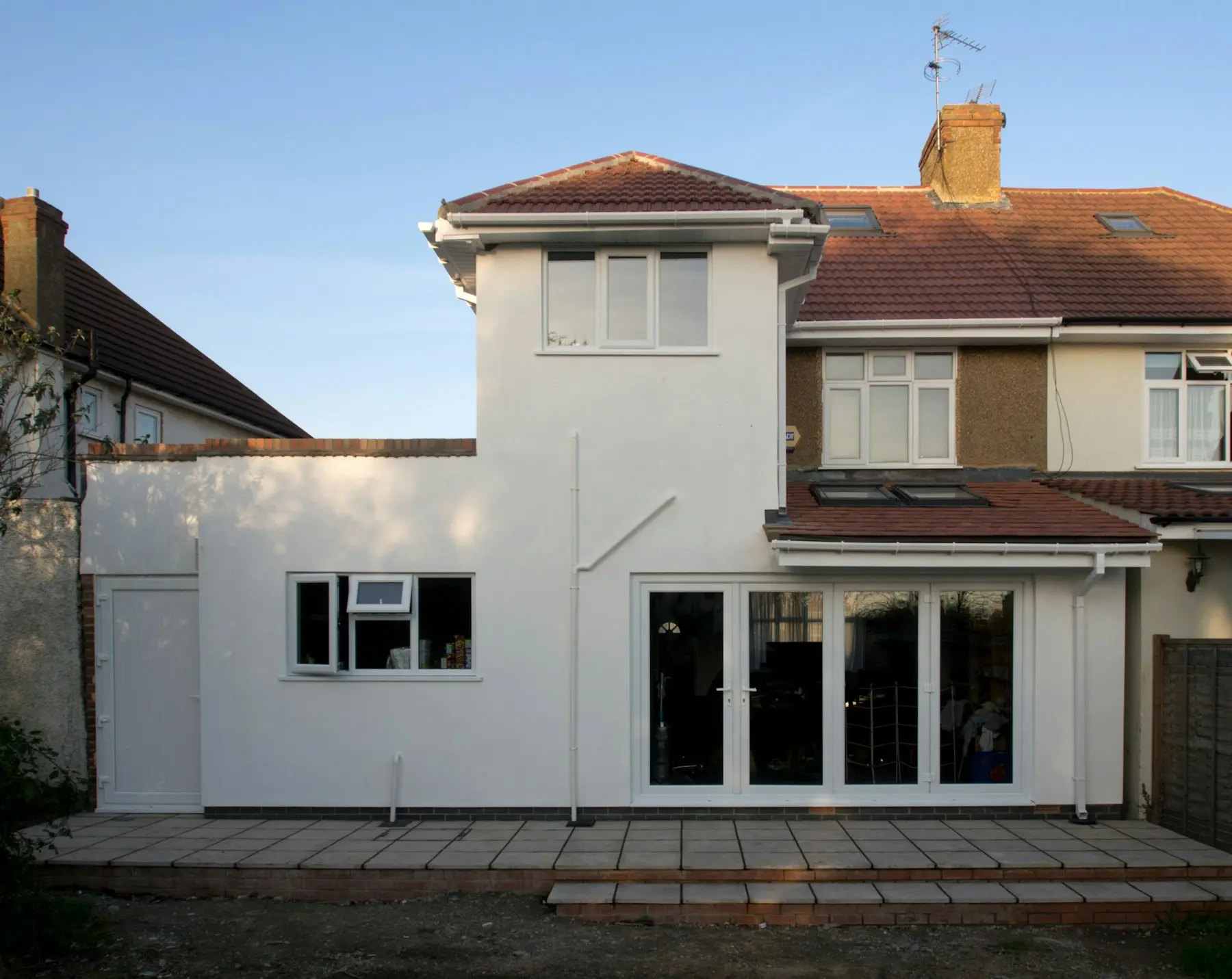 Single-story rear home addition with French doors
